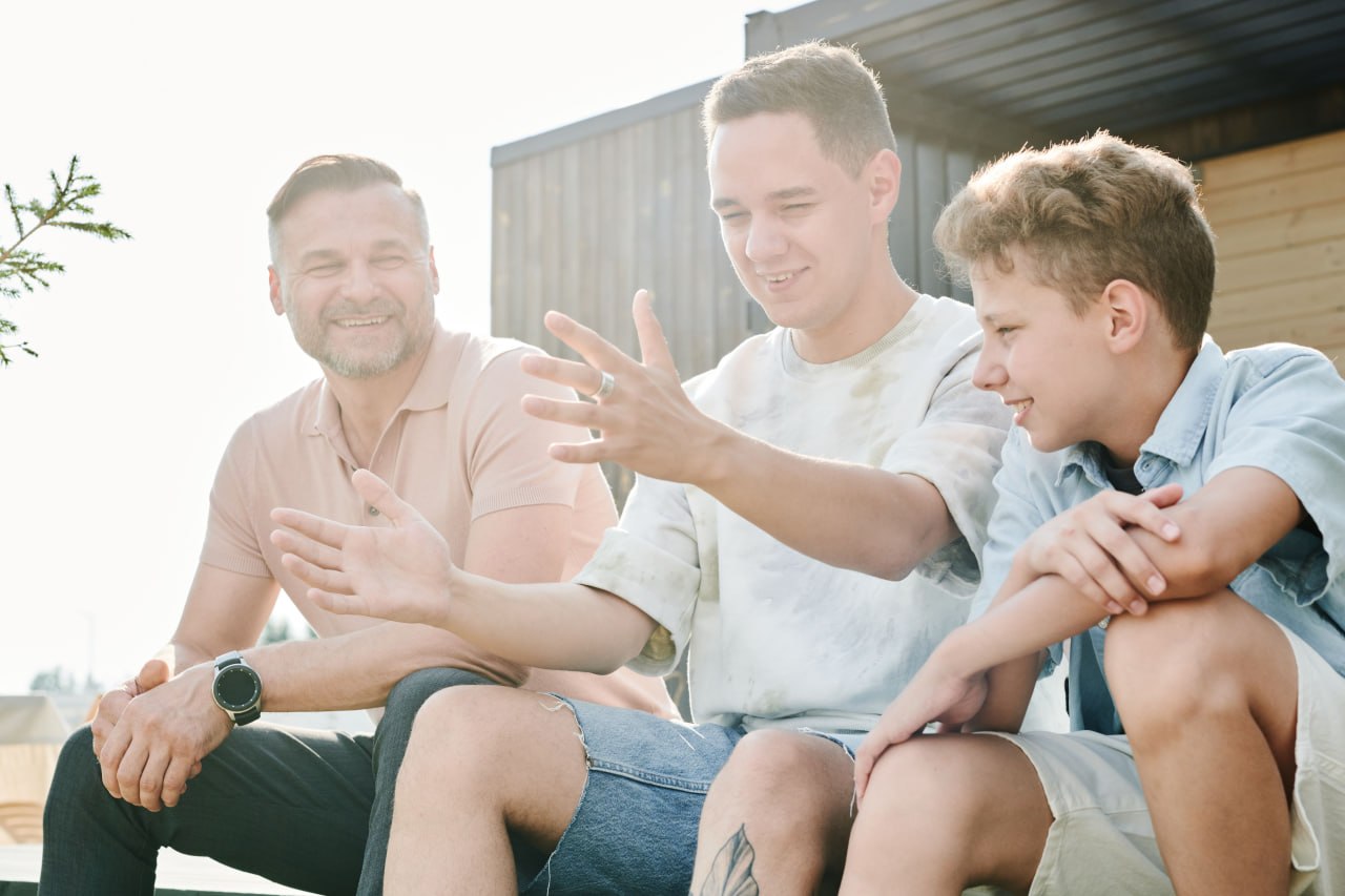 A father and son in conversation outside